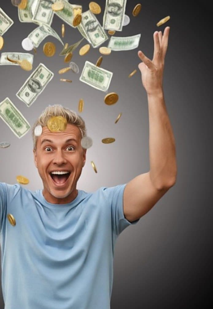 Gary Vaughan celebrating as cash rains down